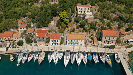 Aerial drone photo of picturesque beautiful seaside village of Kioni a safe anchorage for yachts...