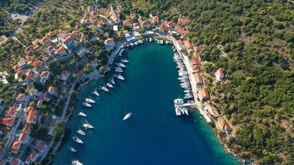 Aerial drone photo of picturesque beautiful seaside village of Kioni a safe anchorage for yachts...