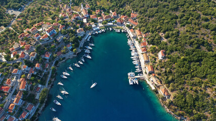 Aerial drone photo of picturesque beautiful seaside village of Kioni a safe anchorage for yachts and sail boats, a true gem of Ithaki or Ithaca island, Ionian, Greece