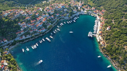 Aerial drone photo of picturesque beautiful seaside village of Kioni a safe anchorage for yachts...