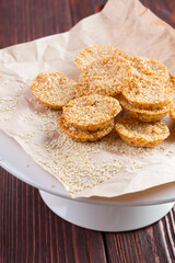 Oat cookies served on wooden table close up