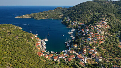 Aerial drone photo of picturesque beautiful seaside village of Kioni a safe anchorage for yachts...