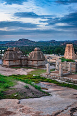hampi ruins ancient stone art with dramatic sky flat angle shot