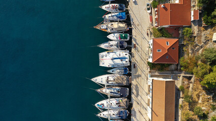 Aerial drone photo of picturesque beautiful seaside village of Kioni a safe anchorage for yachts...