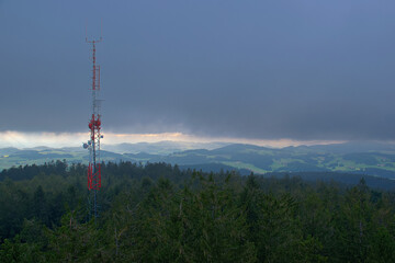 View from the lookout tower Breitenstein in Kirchschlag towards the sent-towers during storms and rain