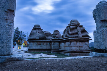 hampi ruins ancient stone art with dramatic sky flat angle shot