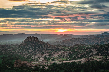 rocky mountain sunrise with dramatic sky at dawn flat angle shot