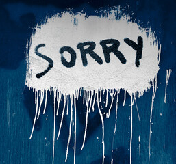 writing word - SORRY. a large gray or white dry  spot on the black metal door. empty copy space for...