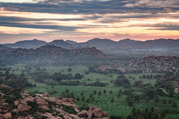 rocky mountain sunrise flares with dramatic sky at morning flat angle shot