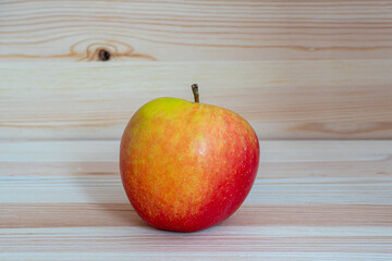 Red fresh apple on wood table