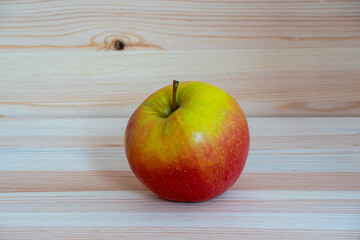 Red fresh apple on wood table