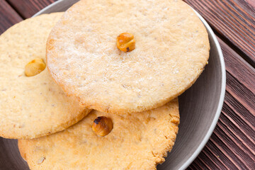 Oat cookies served on wooden table close up