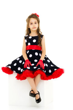 Portrait of Pretty Girl Wearing Retro Style Polka Dot Dress