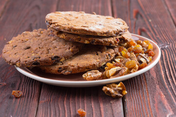 Oat cookies served on wooden table close up
