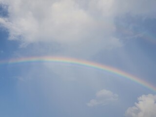 Rainbow in the bright morning sky