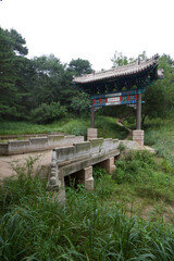 stone archway and stone bridge at a Chinese ancient garden