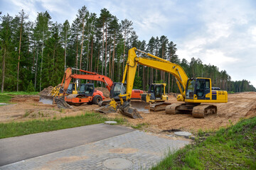Bulldozer, Excavator and Soil compactor on road work. Earth-moving heavy equipment and Construction...