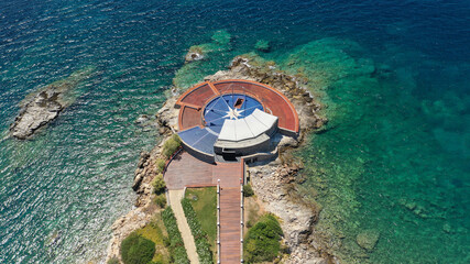 defaultAerial panoramic view of famous Grand Resort Lagonisi or Lagonissi paradise peninsula and beach with pool facilities in exotic peninsula, Athens riviera, Attica, Greece