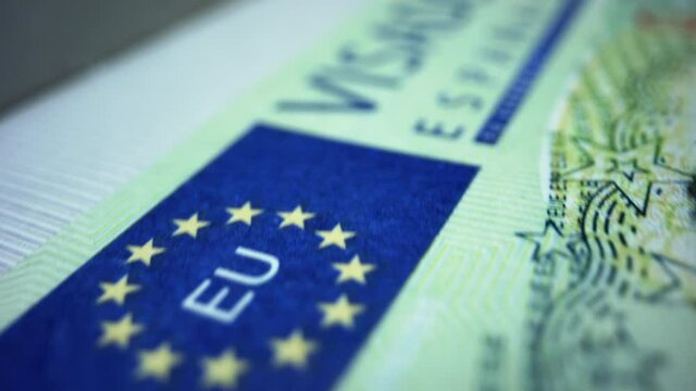 Spanish visa in foreign passport. Schengen visa in document. Travelling concept