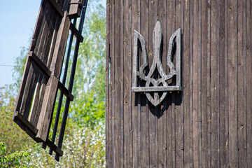 VYTACHIV, UKRAINE - MAY 3,2020: Old windmill with Emblem of Ukraine in Vytachiv, Ukraine on May 3,...