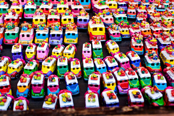 Fototapeta na wymiar Small souvenir cars for sale on the market, Chichicastenango, Guatemala