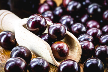 Brazilian fruit called jaboticaba or jabuticaba, is the native grape of Brazil. Plinia cauliflora species, on a rustic table, exotic fruit, anti-inflammatory.
