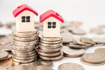 House on stack coins, mortgage home loan finance concept.
