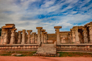 hampi ruins antique stone art from unique angle with amazing sky