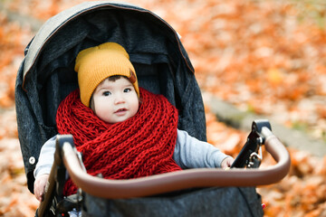 child in a red knitted scarf