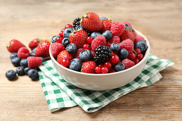 Mix of ripe berries on wooden table © New Africa