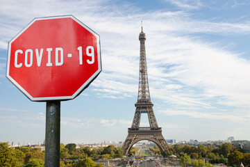 Fototapeta na wymiar COVID-19 sign with Eiffel tower in Paris, France. Warning about pandemic in France. Coronavirus disease. COVID-2019 alert sign