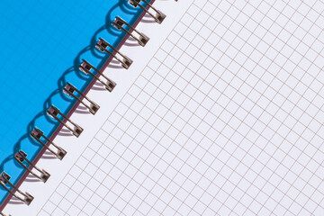 Plaid notebook with blue cover close up