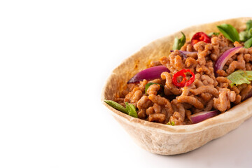 Mexican barquita taco with beef, chilli, tomato, onion and spices isolated on white background. Copy space