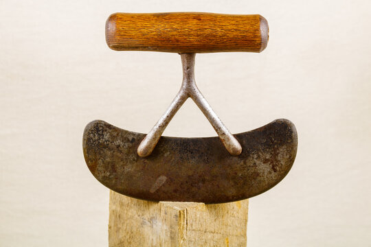 Vintage Cowboy Hash Knife on a Block of Wood
