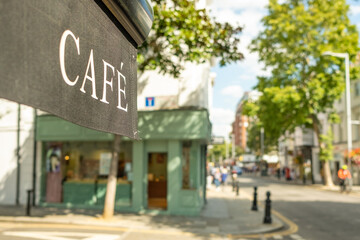 An attractive London street of shops and cafes with background blur