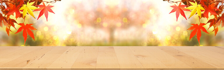 web banner wooden tabletop with fall and autumn season design with red maple background