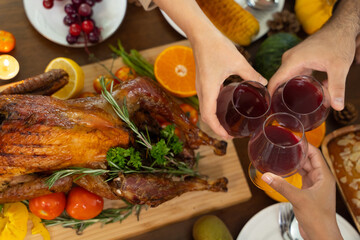 Group of people enjoying dinner with turkey together. Dining Wine Cheers Party thanksgiving Concept