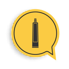Black Tube of toothpaste icon isolated on white background. Yellow speech bubble symbol. Vector.