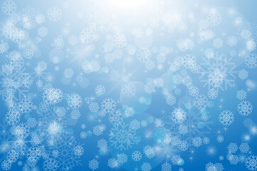 Winter snowfall on a blue background. Cold winter. Christmas and New Year background. White snowflakes on a blue background.