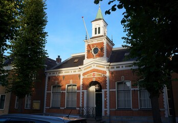 The beautiful building of city council in Bergambacht in evening sunset light