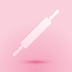 Paper cut Rolling pin icon isolated on pink background. Paper art style. Vector.