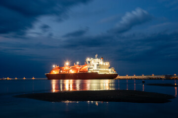 Tanker in the port with lights on, night photography