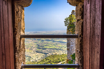 A twin bar window provides a panoramic view from Kantara Castle over the Mesaoria Plain in Northern...