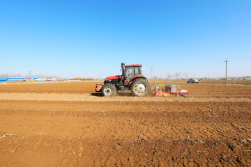 Planter planting peas on farm, North China