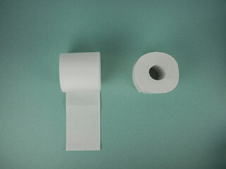 rolls of toilet paper on the table.