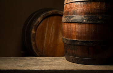 Old wooden barrel on a brown background
