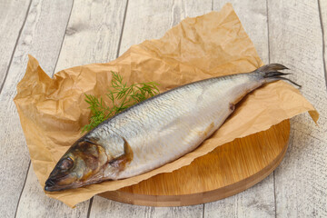 Salted herring over the wooden board