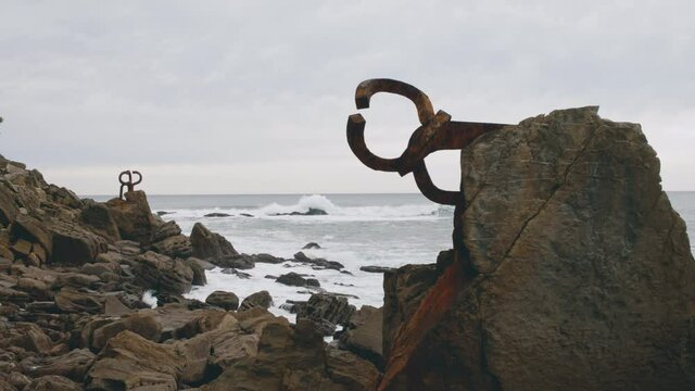 4K The Comb of the Wind sculpture (Peine del Viento) and waves in Donostia-San Sebastian, Basque Country, Spain, Cantabrian Sea - slow motion
