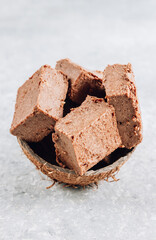 Raw vegan chocolate fudge. Healthy vegan food concept.