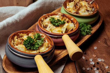  Three pots of julienne on a wooden table